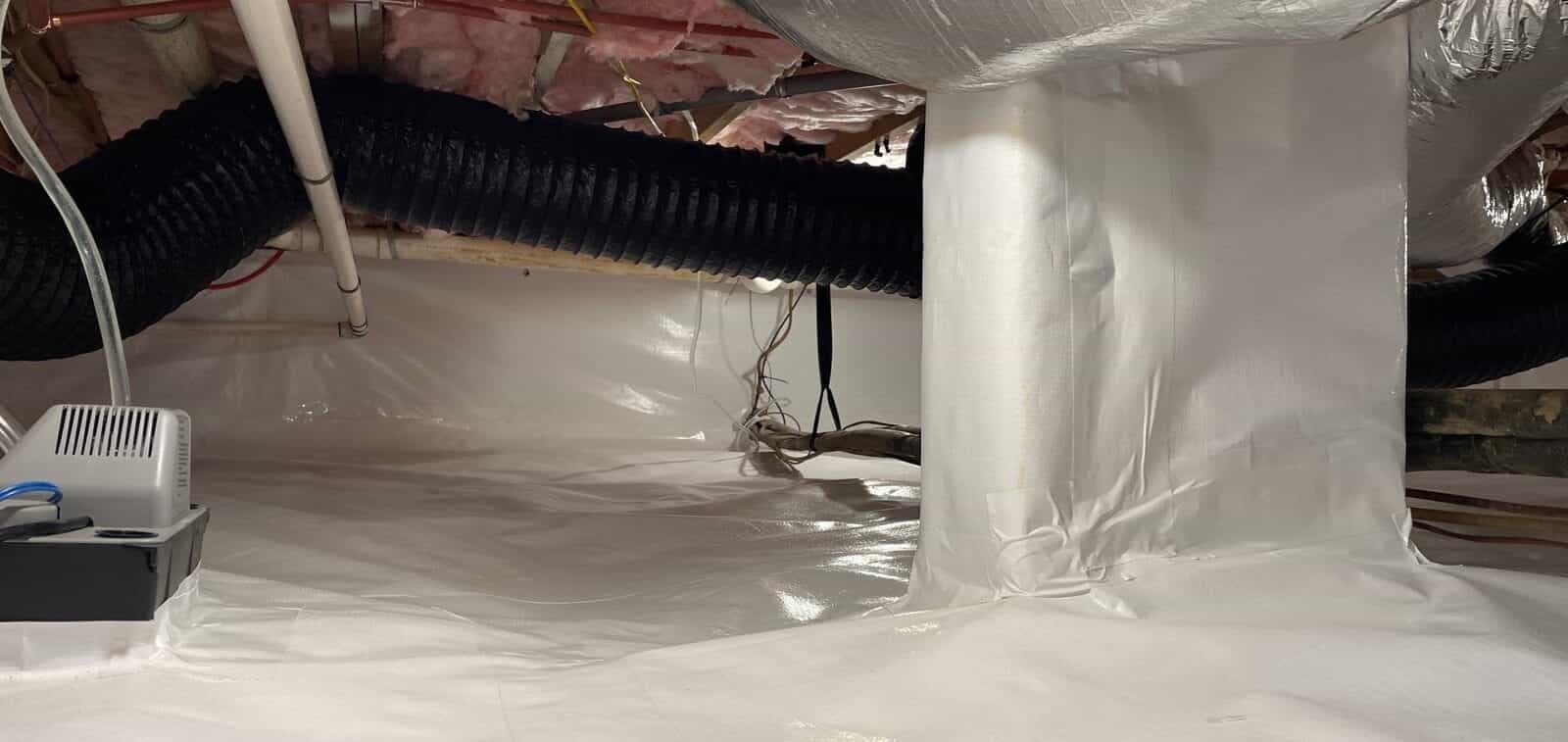 Finished crawl space liner with a wrapped pier and the floor sealed.