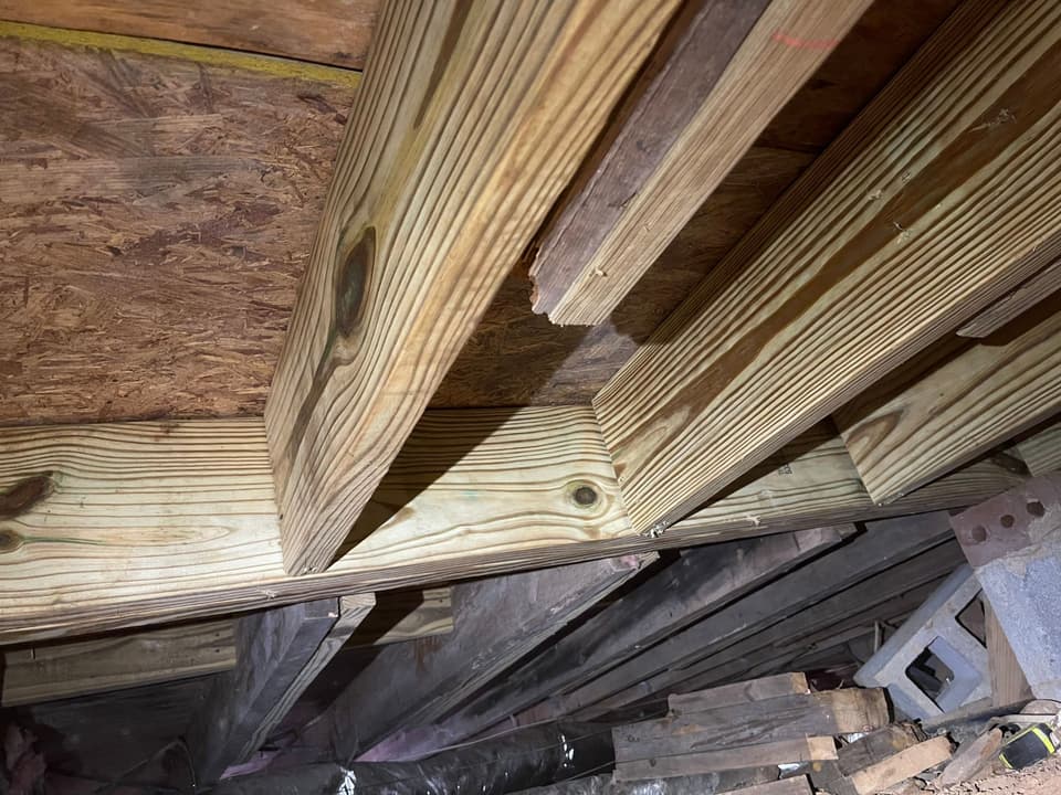 HydroHelp911 Crawl Space & Foundation Repair performing joist sistering for structural repair in a crawl space.