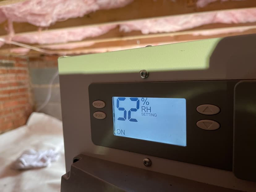 HydroHelp911 Crawl Space & Foundation Repair dehumidifier operating at 52% relative humidity setting in a crawl space.