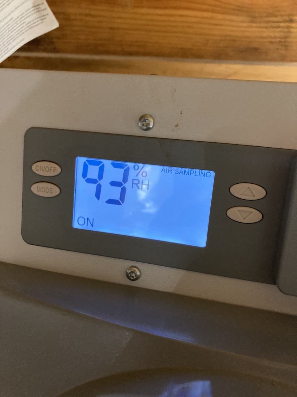 HydroHelp911 Crawl Space & Foundation Repair inspecting high humidity levels with a dehumidifier displaying 93% RH.