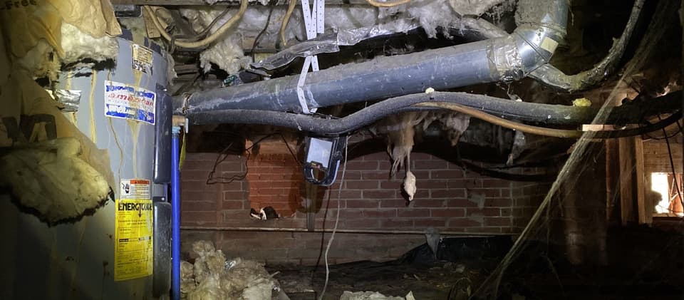 HydroHelp911 Crawl Space & Foundation Repair cleaning a dirty crawl space with existing ground cover