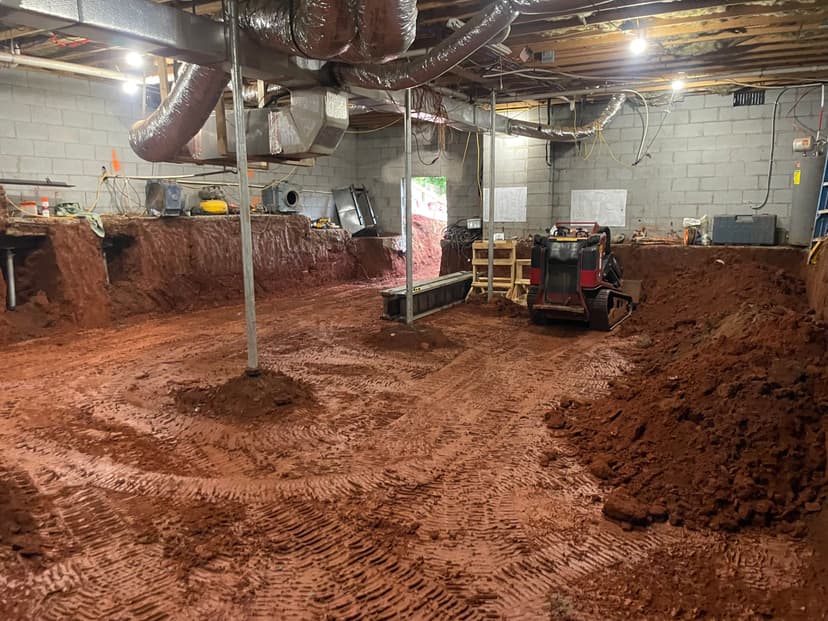 HydroHelp911 Crawl Space & Foundation Repair performing crawl space structural repair with excavation and new support jacks.
