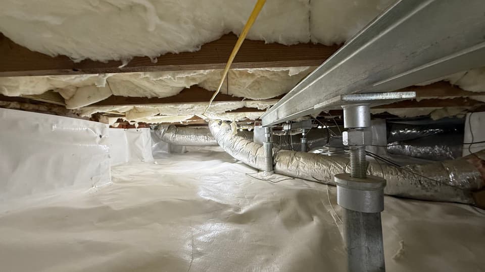 HydroHelp911 Crawl Space & Foundation Repair installing crawl space jacks and a vapor barrier