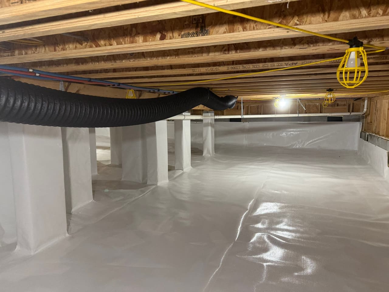 HydroHelp911 Crawl Space & Foundation Repair completed a full crawl space encapsulation system with a vapor barrier.