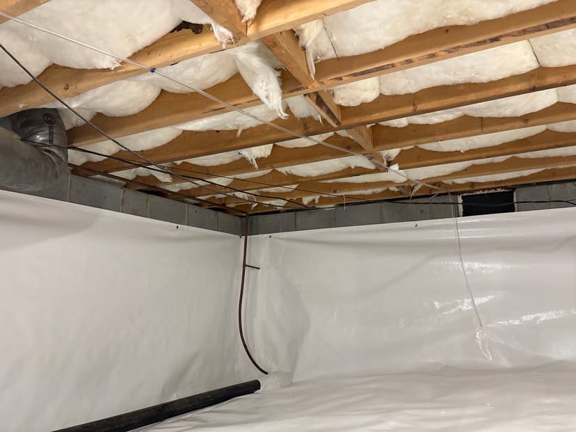HydroHelp911 Crawl Space & Foundation Repair installing a vapor barrier and inspecting insulation in a crawl space.