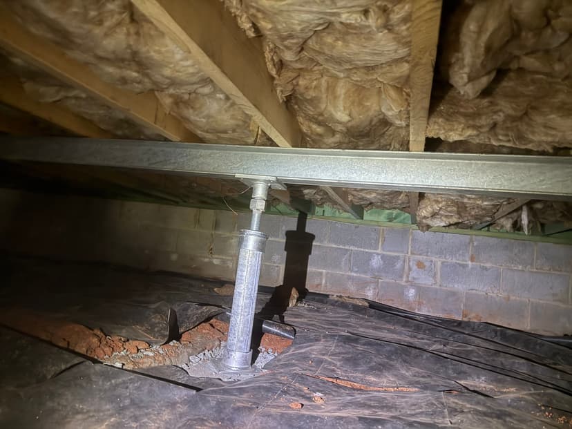 HydroHelp911 Crawl Space & Foundation Repair installing adjustable steel crawl space jacks for sagging floors