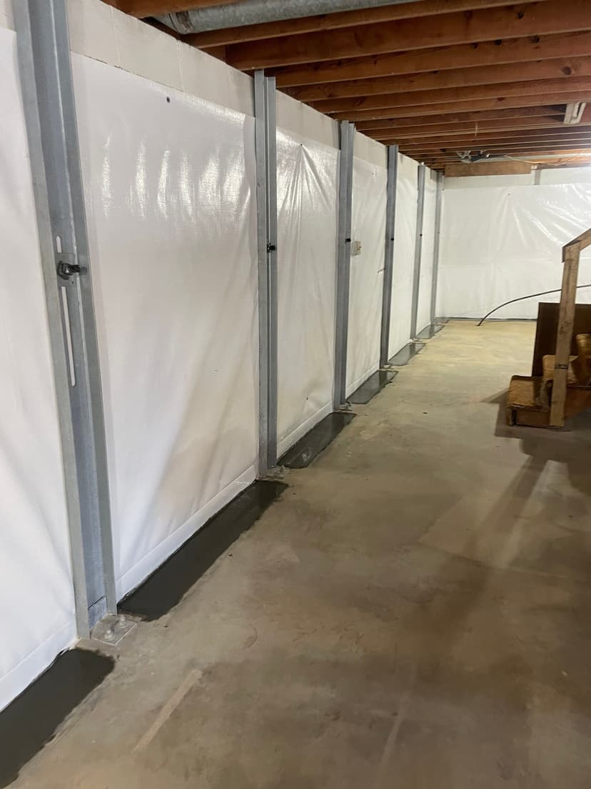 HydroHelp911 Crawl Space & Foundation Repair installing basement wall liner, subfloor drainage