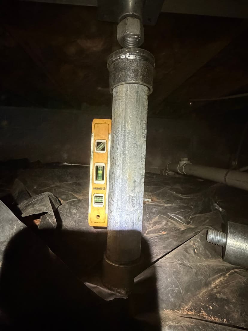 HydroHelp911 Crawl Space & Foundation Repair installing and leveling a crawl space jack support system.