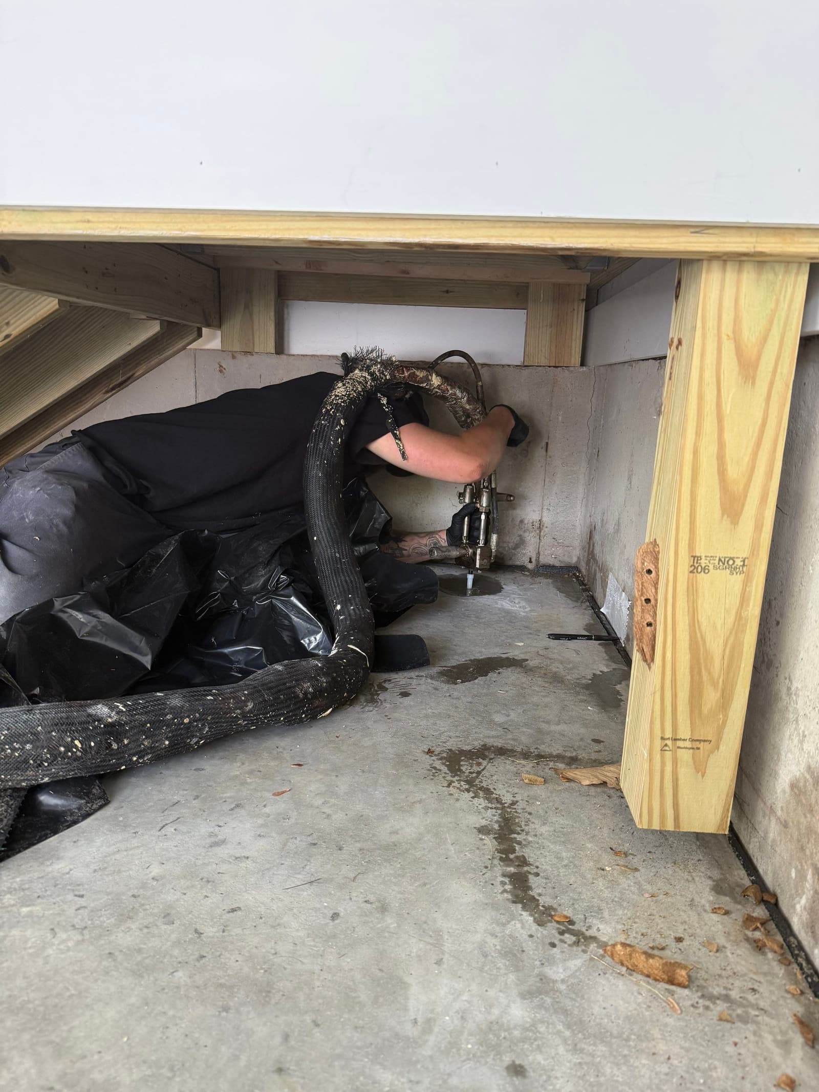 HydroHelp911 Crawl Space & Foundation Repair performing polyurethane foam injection for interior slab leveling.