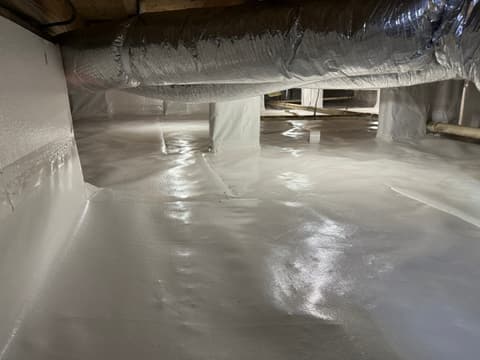 HydroHelp911 Crawl Space & Foundation Repair completed crawl space encapsulation with a white vapor barrier and sealed seams.