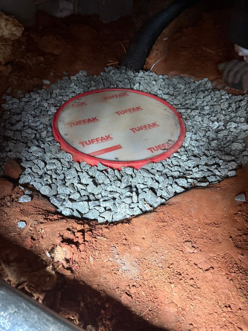 HydroHelp911 Crawl Space & Foundation Repair installing a crawl space sump pump for interior drainage.