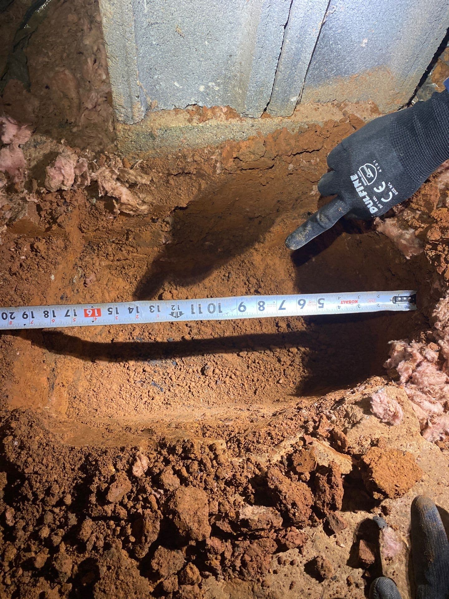 HydroHelp911 Crawl Space & Foundation Repair installing a drainage trench for a crawl space drainage system