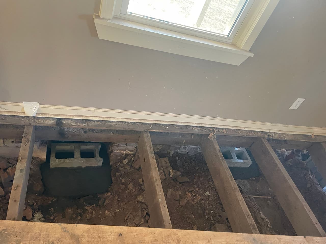 HydroHelp911 Crawl Space & Foundation Repair installing concrete block piers for crawl space structural repair.