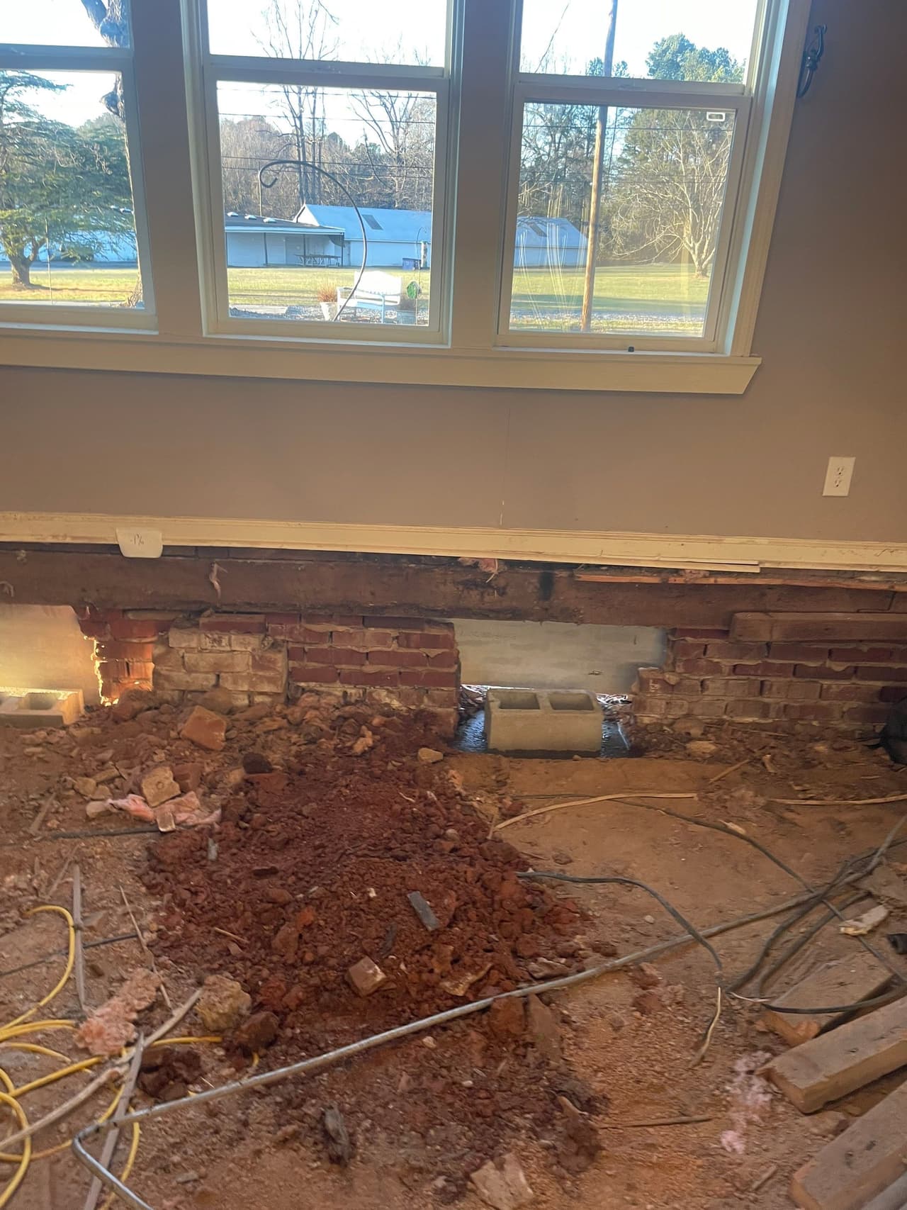 HydroHelp911 Crawl Space & Foundation Repair performing structural repair on a crawl space foundation.