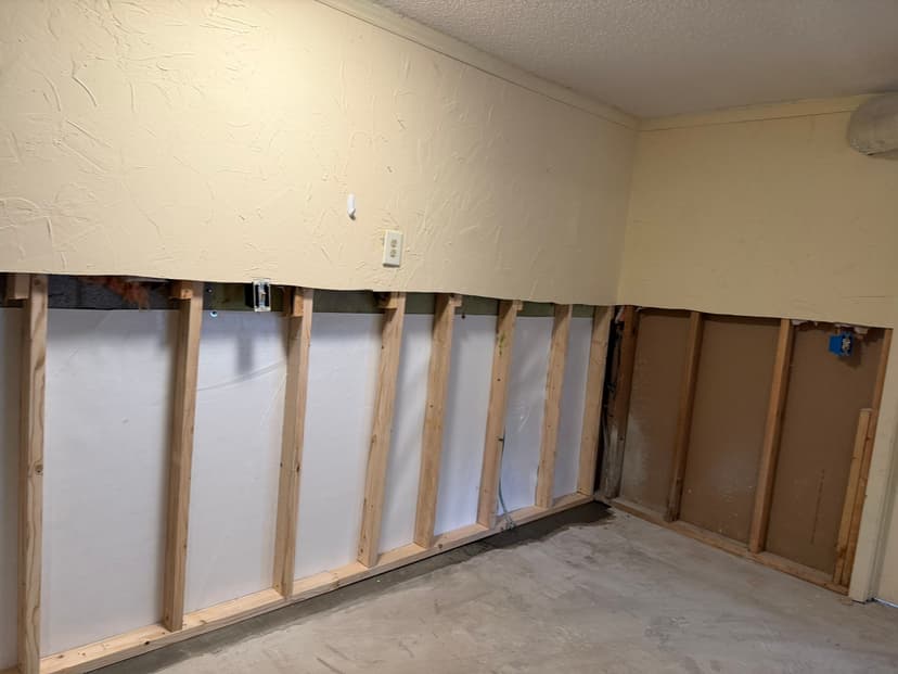 HydroHelp911 Crawl Space & Foundation Repair installing a vapor barrier for interior waterproofing