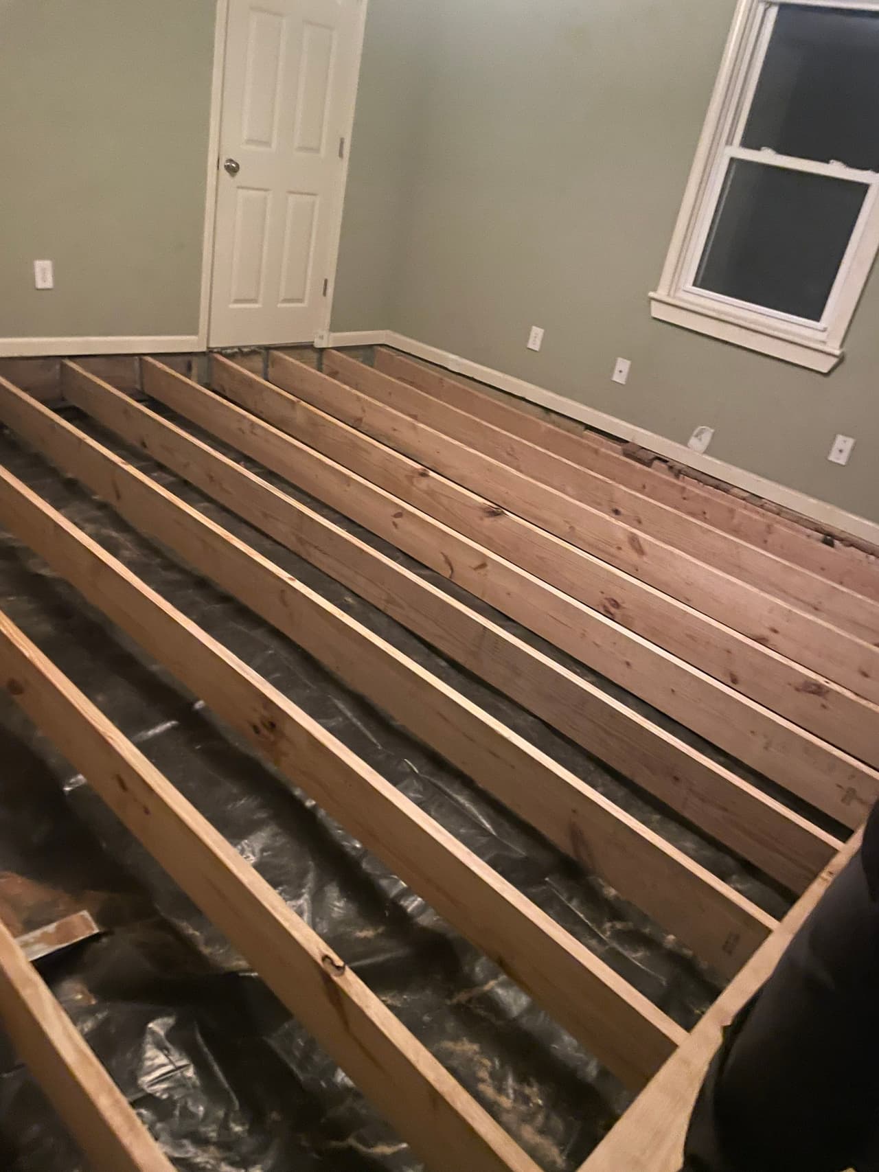 HydroHelp911 Crawl Space & Foundation Repair crew installing new floor joists during a structural repair.