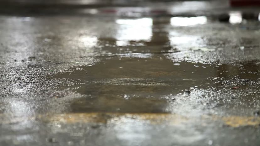 HydroHelp911 Crawl Space & Foundation Repair inspecting standing water from a plumbing leak in a crawl space.