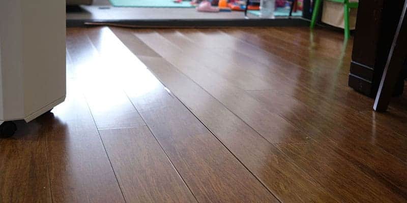 Wood floor with a visible dip and uneven boards