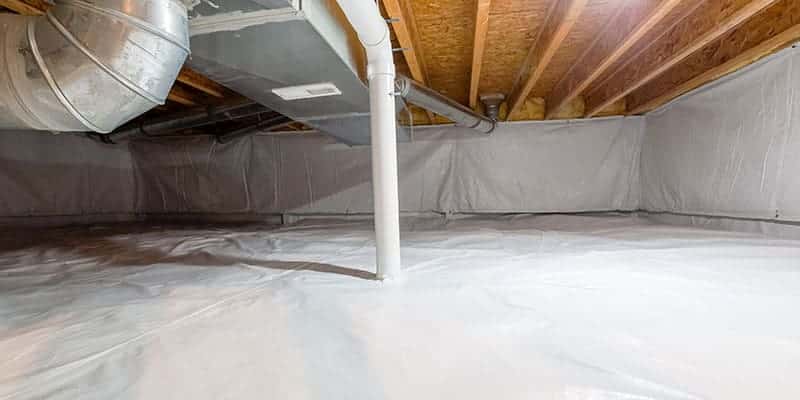 White vapor barrier liner covering a crawl space floor