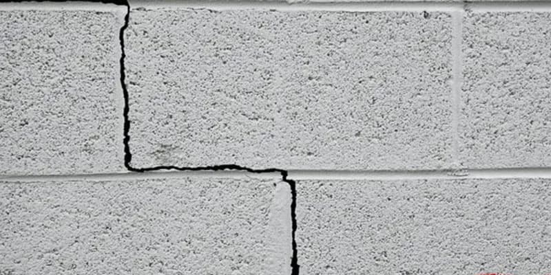 Stair step crack through mortar joints in a concrete block wall