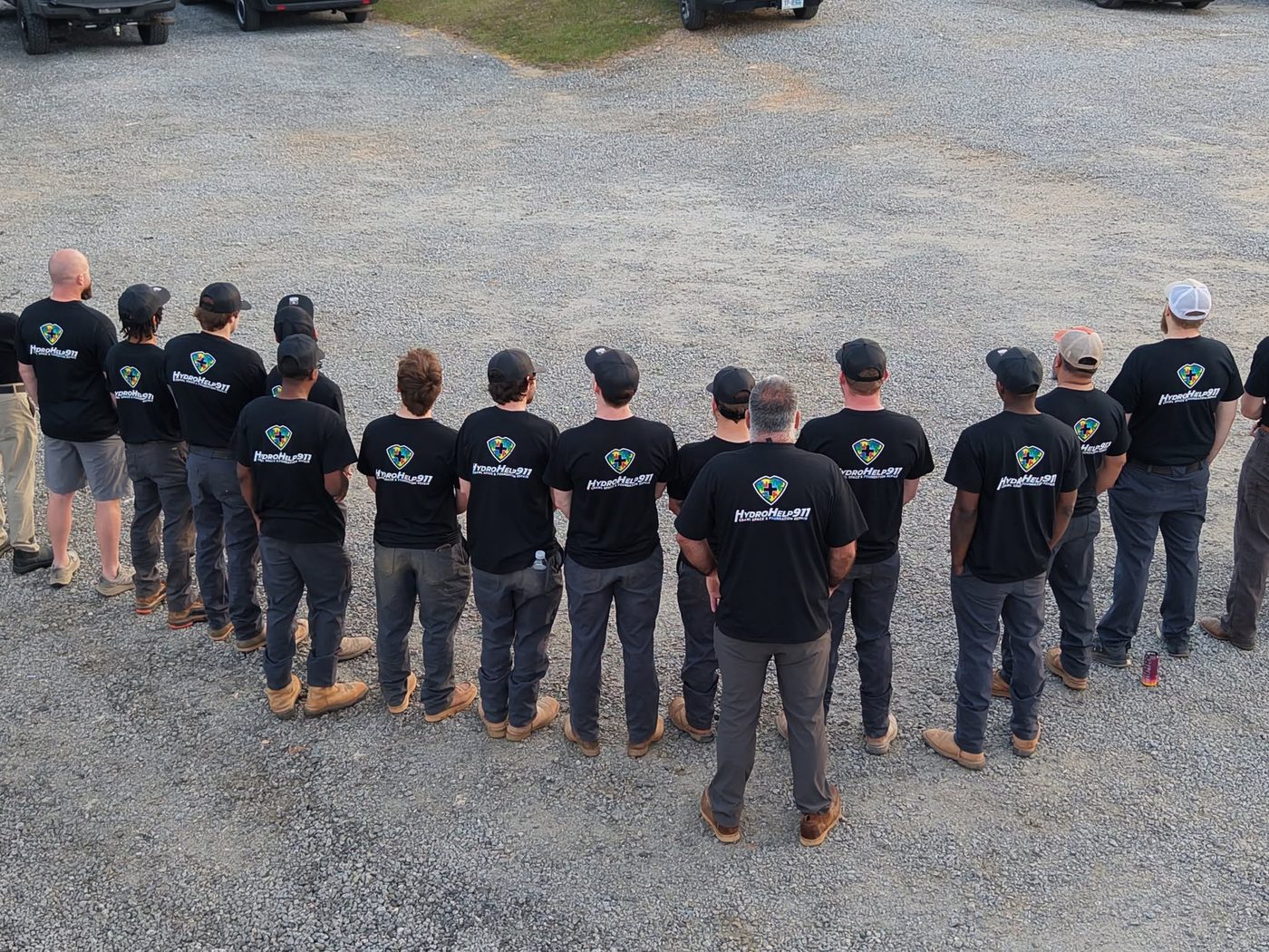 HydroHelp911 team in autism awareness shirts supporting Autism Acceptance Month