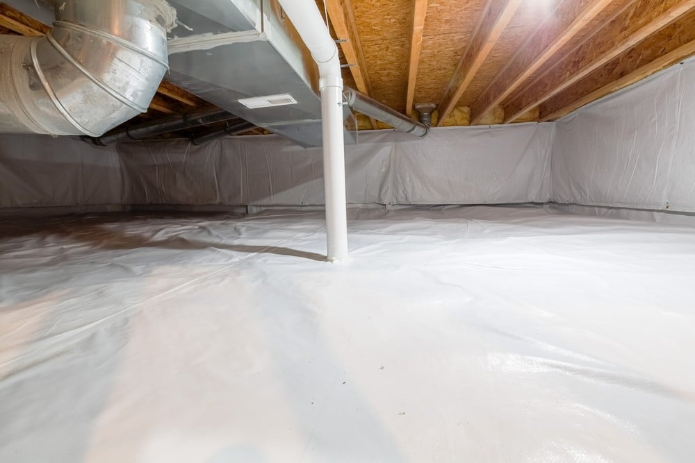 Encapsulated crawl space with a white liner on the floor and walls